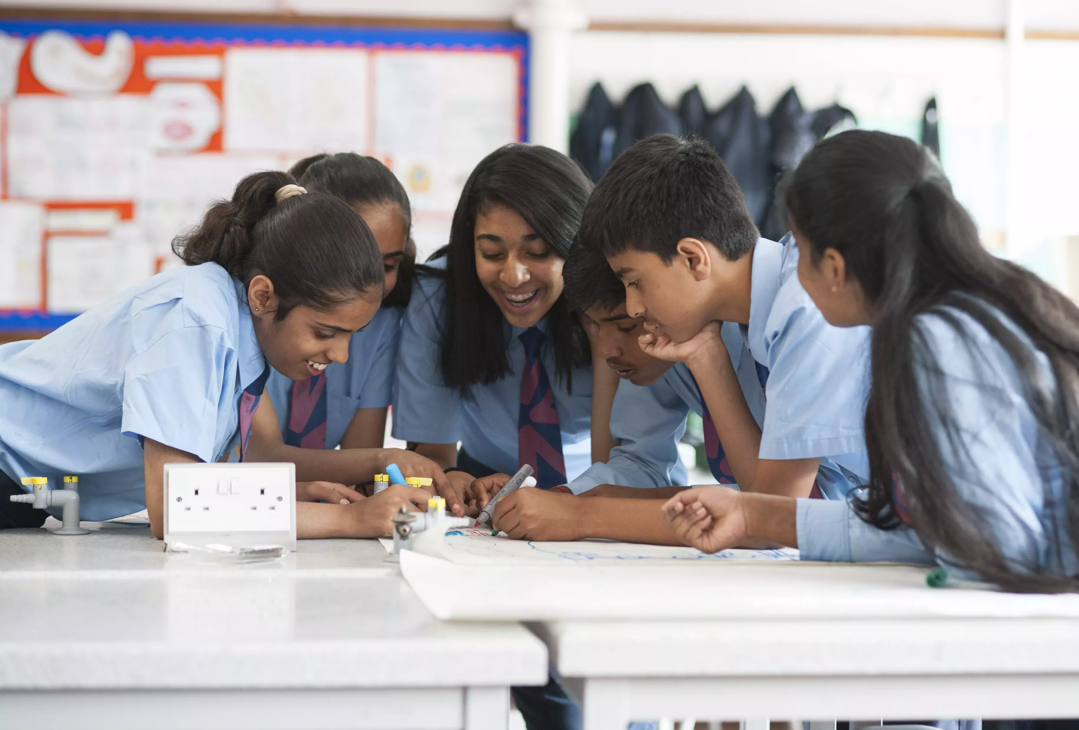 Pupils working as a group on a written task