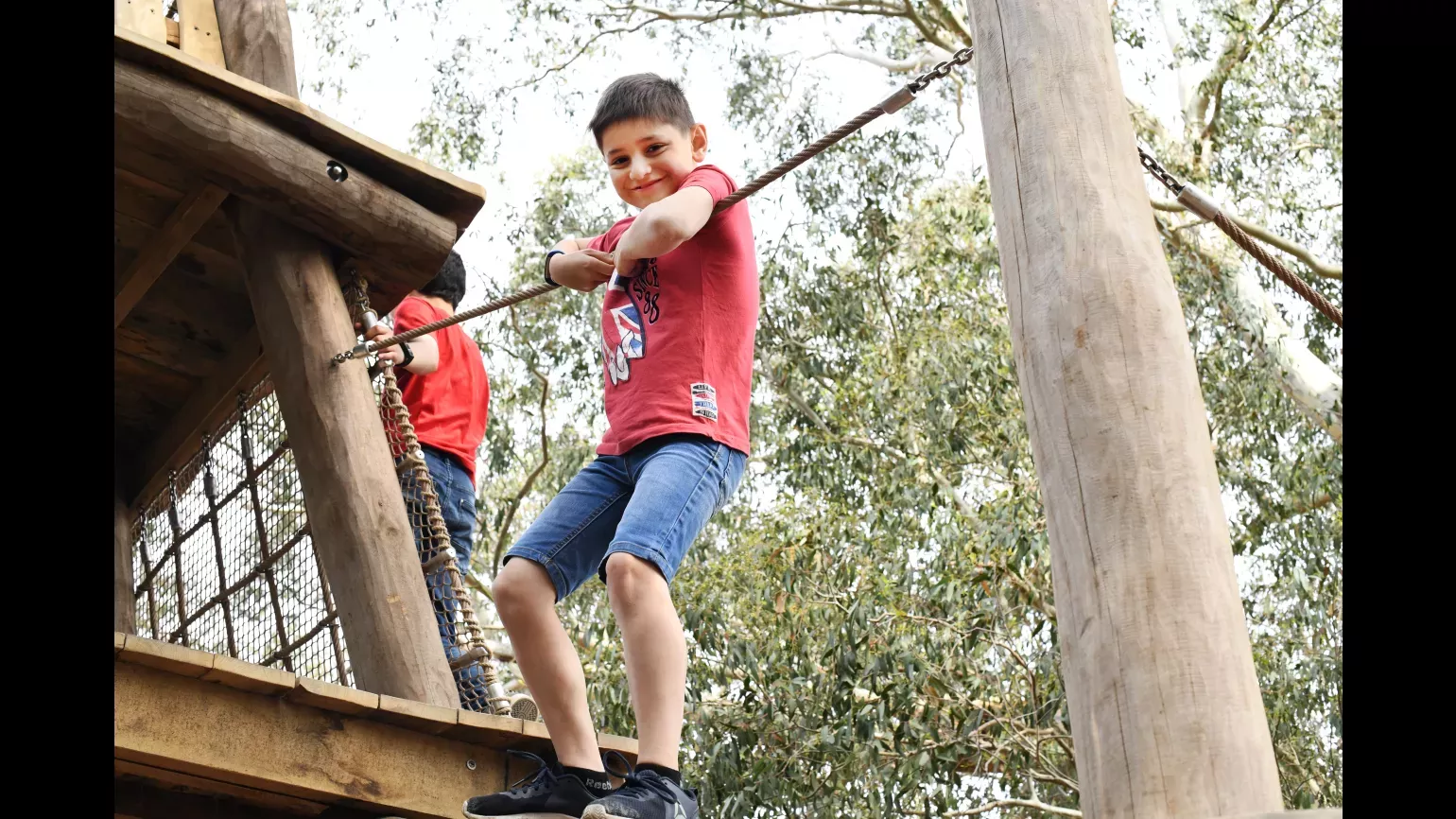 Boy playing in the Children's Garden