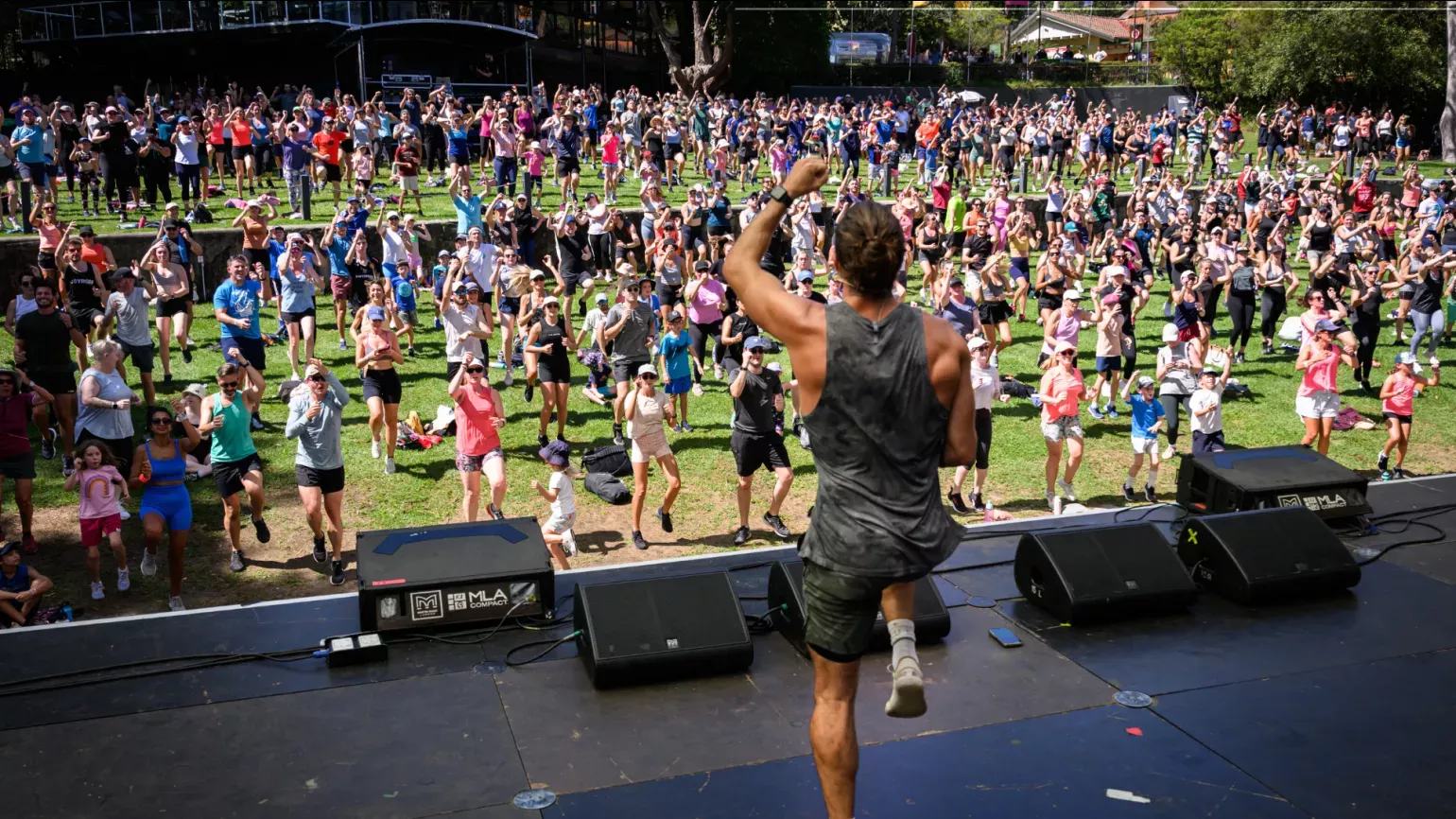 Joe Wicks onstage looking out onto audience