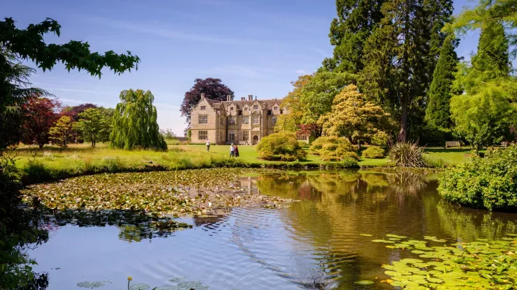 Wakehurst Mansion in the background overlooking the pond (foreground)